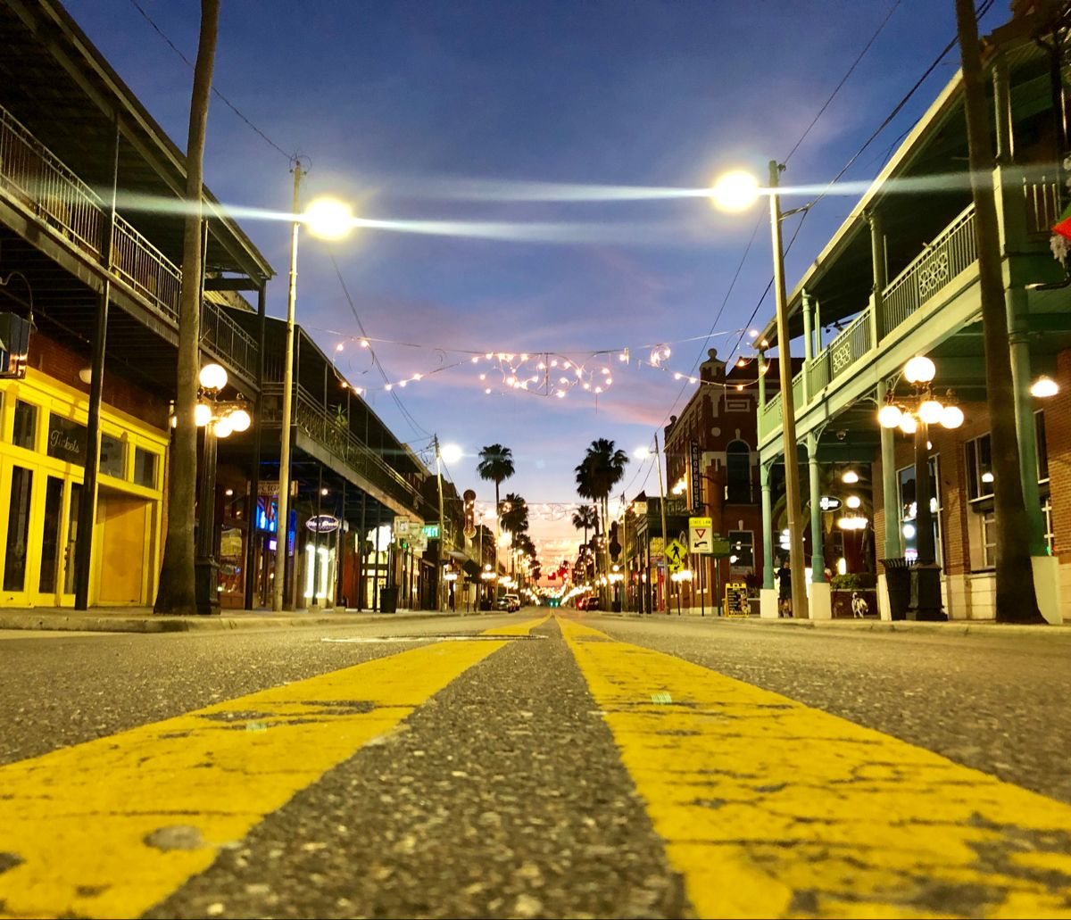 the brick storefronts and street of 7th Avenue in Ybor City, Tampa
